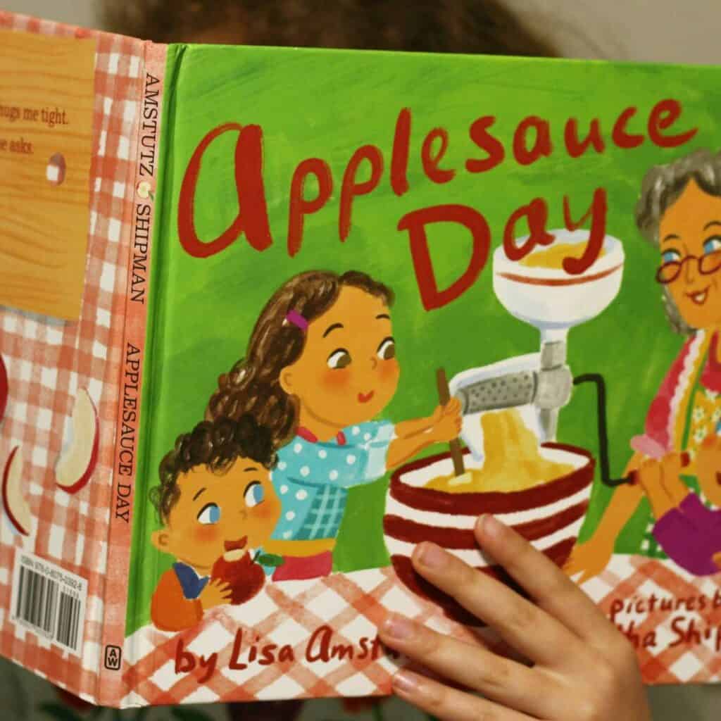 child reading Applesauce Day Book